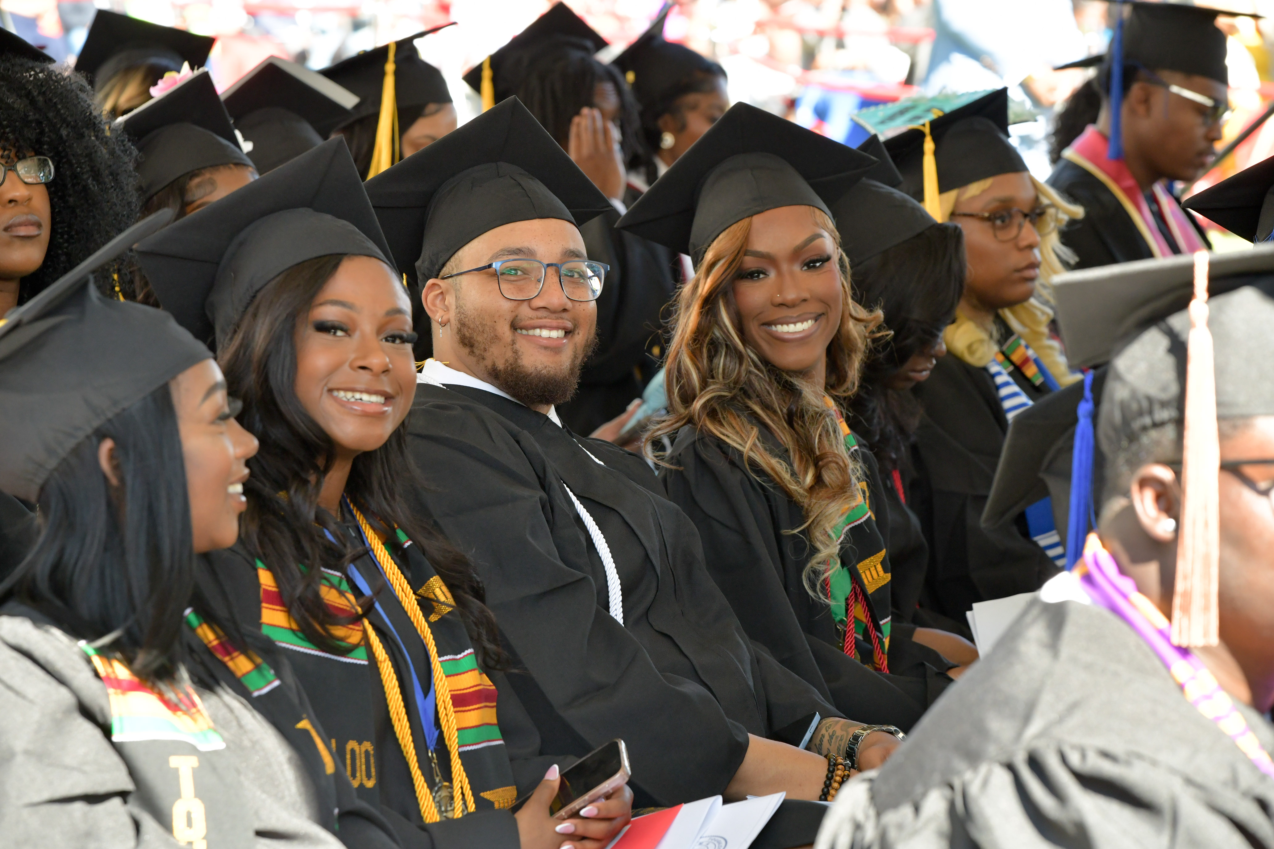 Grads sitting